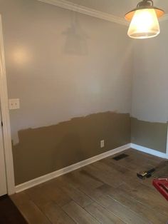 an empty room is being painted with gray paint