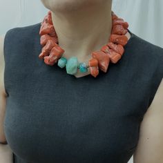 An impressive cut of orange Coral to display its natural splendor is rarely found in the size of Coral.  Extra large natural Coral beads with green Agate accent stone.   This is a statement necklace and a conversation piece.  The bright orange is elegant for Summer, and the size and cut are elegant at night.  The perfect combination of color and size to travel and complement any outfit. Unique Orange Agate Necklace, Orange Red Coral Jewelry With Natural Stones, Unique Orange Red Coral Necklace, Orange Jewelry With Natural Stones And Red Coral, Unique Orange Gemstone Bead Necklaces, Unique Coral Necklace With Gemstone Beads, Resin And Clay, Orange Coral, Natural Coral