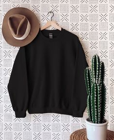 Black T-shirt With Crew Neck And Ribbed Cuffs, Black Cotton Crew Neck Sweater, Black Relaxed Fit Crew Neck Sweatshirt, Basic Black Crew Neck Sweatshirt, Black Crew Neck Sweatshirt With Ribbed Cuffs, Basic Black Crew Neck Sweater, Black Crew Neck Basic Sweater, Basic Black Relaxed Fit Sweatshirt, Basic Black Crew Sweatshirt