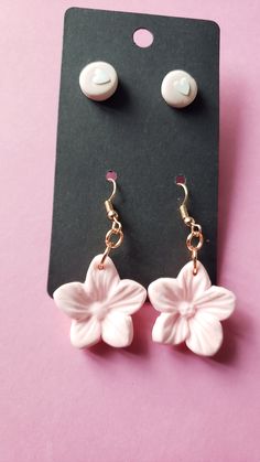 Pink Hawaiian flower earring set include stud pink hearts and flowers!Created from polymer clay they are wonderfully lightweight and dangle about 1.5 inches. We ship supppppeerrrrrr fast too! Pink Dangle Flower Earrings Gift, Pink Dangle Flower Earrings For Gift, Pink Flower Charm Drop Earrings, Pink Drop Flower Earrings For Gift, Pink Flower Drop Earrings For Gift, Pink Cute Earrings With Handmade Flowers, Pink Flower-shaped Earrings For Pierced Ears, Pink Flower Earrings For Pierced Ears, Pink Handmade Flower Drop Earrings