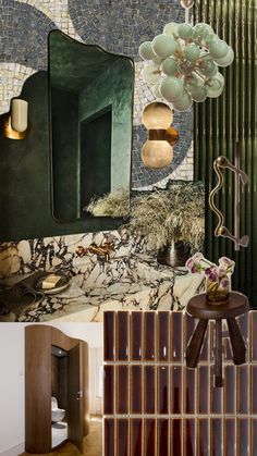 the interior of a bathroom with green walls and marble counter tops, an art deco mirror on the wall