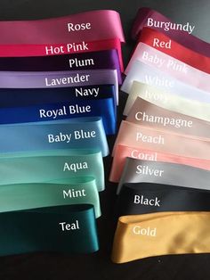 six satin headbands with names on them