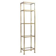 a tall gold metal shelf with glass shelves