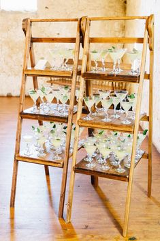 two wooden shelves with wine glasses on them