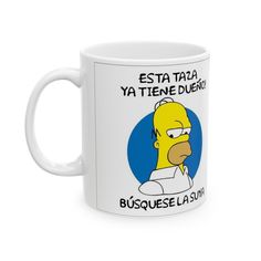 a white coffee mug with an image of the simpsons on it's front and side