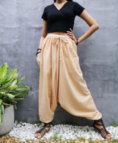 "The harem style trousers made from cotton fabric 100%with an elasticated smock waist and ankles they provide a comfortable lightweight fit, perfect for casual wear, festivals, yoga, holidays as well as pairing with a plain top to get that popular look. D I S C O U N T & P R O M O T I O N ❤ Buy 2 or more items, get 10% off ❤ Buy 4 or more items, get 15% off ENTER the coupon code: IYARA015 ❤ Buy 6 or more items, get 15% off ENTER the coupon code: IYARA020 PLEASE NOTE I can not apply a discoun Beige Baggy Wide-leg Harem Pants, Beige Wide-leg Harem Pants, Baggy Beige Bohemian Bottoms, Beige Baggy Bohemian Bottoms, Bohemian Parachute Pants For Yoga With Elastic Waistband, Beige Harem Pants For Summer, Bohemian Parachute Pants For Yoga, Bohemian Cotton Wide-leg Harem Pants, Casual Harem Pants For Festivals