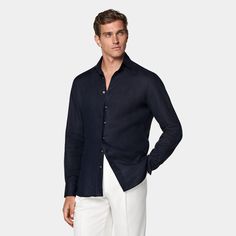 This casual navy tailored fit shirt is cut to a shorter length for versatile styling, and crafted with ultra-fine stitching, heat-sealed buttons and classic widespread collar. Navy Slim Fit Shirt For Summer, Fitted Linen Shirt For Semi-formal Occasions, Navy Slim Fit Collared Shirt, Navy Collared Slim Fit Shirt, Navy Slim Fit Collared Top, Navy Fitted Dress Shirt For Work, Navy Long Sleeve Semi-formal Shirt, Semi-formal Fitted Linen Tops, Navy Long Sleeve Business Casual Shirt