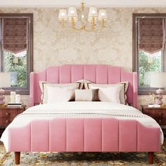 a pink bed sitting in a bedroom next to two nightstands and a chandelier