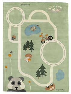 a green rug with animals and trees on the ground in front of a road map