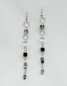 Dangle Earrings, Ring and Block Chain with Black and Clear Block Beads in Silver or Gold Tone, Conte Modern Jewelry With Dangling Beads As A Gift, Black Beaded Chain Earrings As A Gift, Elegant Silver Beaded Chain Earrings, Metal Drop Earrings With Beaded Chain, Black Beaded Chain Dangle Jewelry, Silver Beaded Chain Earrings As Gift, Black Beaded Dangle Jewelry, Minimalist Silver Jewelry With Dangling Beads, Modern Wire Wrapped Jewelry For Party