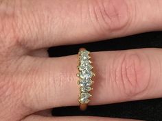 "The item is a 18 k yellow gold marquise diamond ring. The ring consists of nine marquise shaped diamonds that graduate in size from 5 x 2.5 millimeters down to 2.5 x 1.5 millimeter. The total carat weight of the diamonds is 0.65 carats. The diamonds have a \"H\" color and an \"SI 1\" clarity grading. Each diamond is held in with two prongs. The ring is a finger size 8 and I can size it for you at no charge. The ring weighs 4.8 grams. I will provide a ring box. I can also provide a free written Marquise Cut Rings With Single Cut Diamonds, Formal Yellow Gold Marquise Diamond Ring, Anniversary Marquise Cut Diamond Ring With Prong Setting, Marquise Yellow Gold Wedding Ring With Vvs Clarity, Marquise Single Diamond Ring For Formal Occasions, Marquise Diamond Ring With Single Diamond For Formal Occasions, Marquise Yellow Gold Diamond Ring With Single Cut Diamonds, Formal Marquise Diamond Ring With Single Diamond, Formal Marquise Cut Brilliant Diamond Ring