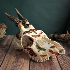 a small animal skull on a wooden table