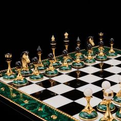 a chess board with green and gold pieces on it