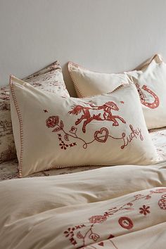 Add a Western layer to your bedding with these embroidered cotton pillow shams. These textural pillow shams are complete with rodeo-inspired icons stitched at the top. Pair them with our Embroidered Rodeo Duvet Cover for a coordinated bedding set. Available exclusively at Urban Outfitters. Features Embroidered rodeo pillow shams from UO Home in soft cotton Textural pillow sham set with embroidered Western icons at the top panel Backed with a solid cotton panel Envelope closure at the solid back for easy removal Statement ties at the edges to keep your pillows secure An eco-friendly upgrade, this item is OEKO-TEX® Standard 100 certified free of harsh chemicals UO exclusive Content + Care Includes 2 pillow shams Pillow inserts sold separately 100% Cotton OEKO-TEX® Standard 100 Certified Meet Australia Clothes, Uo Home, Christmas Gifting, Red Fits, Pillow Texture, Apartment Furniture, Wishful Thinking, Cotton Pillow, Come Home