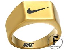 a gold ring with the nike logo on it