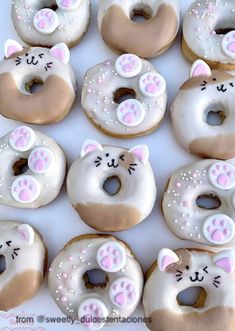 there are many donuts decorated with cats and kittens on them in the shape of doughnuts