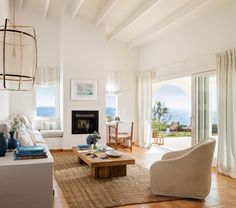 a living room filled with furniture and a fire place