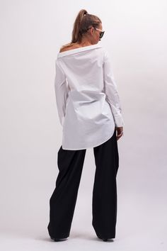 Easy and breezy, the Unstoppable Cotton womens white shirt features an asymmetrical construction, a wide avant garde collar, relaxed sleeves, and an asymmetrical button closure. With black pants, this white cotton long sleeve shirt makes Monday mornings bearable. The White asymmetrical shirt is designed to be comfortable and not troublesome to wear. After wearing this White long sleeve shirt women, you will love it even more. The white blouse for women is made of high quality fabric with cottone Oversized Elegant Cotton Blouse, Oversized Elegant Cotton Top, Elegant Oversized Cotton Top, Oversized Long Sleeve Cotton Blouse, Oversized Cotton Long Sleeve Blouse, Modern Oversized Blouse For Office, Chic Workwear Tops With Curved Hem, Chic Relaxed Fit Long Sleeve Top, Chic Tops With Curved Hem For Work