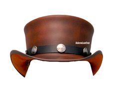 Leather Top Hat Bull Button Band Style Steampunk Top Hat Brown Top Hat Handmade with 100% Cowhide Leather Gift for him New with Tags Description: * High-Quality Craftsmanship handmade * Real Leather * 100% pure leather **Those living in remote areas will have to pay $45 extra as shipping charges before the item is shipped. Sizing: Heads come in all sizes, and in a lots variety of shapes. Although high quality hats are adaptable, and will usually conform to differences in shape with a little wearing, it is essential that the size be correct for the head. To determine your hat size, measure the circumference around your head, keeping the tape level and firm, across the temples and above the eyebrow ridges. Check the size chart given below. For in-between measurements use the next size up. Ha Steampunk Leather Hat Band With Short Brim, Leather High Crown Top Hat For Festival, Brown Steampunk Hat With Short Brim, Steampunk Leather Brimmed Hat Bands, Steampunk Leather Hat For Festivals, Adjustable Leather Steampunk Top Hat, Steampunk Leather Festival Hat, Brown Leather Steampunk Hat, Brown Steampunk Hat With High Crown