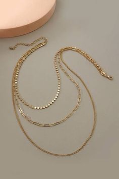 Here is a sophisticated Pretty and practical multi chain necklace that has a unique round chain and link chain. DIMENSION length: 22", 18", 15" ext: 3" Ball Chain Ext clasp: Lobster Claw metal finish: Gold Plated product Cheap Multi-strand Chain Necklace As Gift, Cheap Clavicle Chain Necklaces For Summer, Cheap Multi-strand Layered Necklace With Clavicle Chain, Cheap Minimalist Multi-strand Chain Necklace, Cheap Summer Clavicle Chain Necklaces, Affordable Multi-strand Delicate Chain Necklace, Cheap Multi-strand Delicate Chain Necklace, Cheap Layered Multi-strand Chain Necklace, Cheap Delicate Multi-strand Chain Necklace