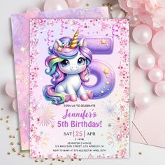 a pink unicorn birthday card with the number five on it and balloons in the background