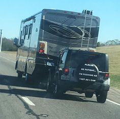 a truck towing a trailer on the road