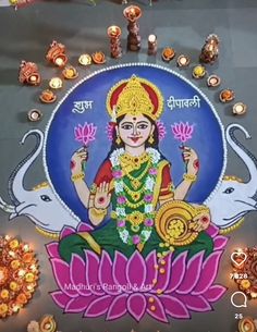 an image of goddess sitting on top of a lotus with candles around her and surrounded by other decorations