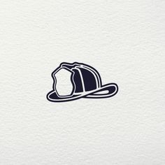 a fireman's helmet on top of a white paper