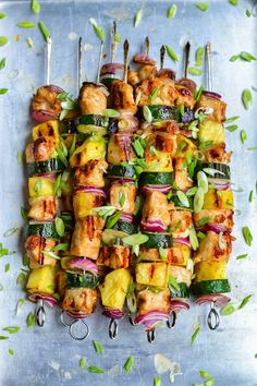 several skewers filled with meat and veggies