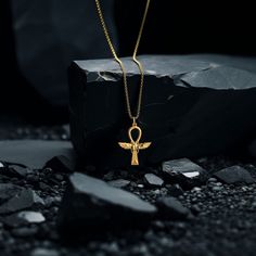 This solid gold key of Ankh necklace showcases exquisite craftsmanship, symbolizing life and spirituality. The key of Ankh pendant is more than just jewelry; it's a fine representation of ancient Egyptian elegance and the timeless allure of this sacred symbol. PENDANT INFORMATIONThis pendant is made of real, solid gold.• Made in USA• Material: 14k or 18k solid gold• Finish: polished• Height: 1.48 (37,5 mm) | *includes the small circle, bail dimensions not included• Width: 1.17" (30 mm)• Pendant Ankh Pendant, Ankh Necklace, Gold Key, Sacred Symbols, Small Circle, Solid Gold Chains, Elegant Jewelry, Ancient Egyptian, Gold Finish