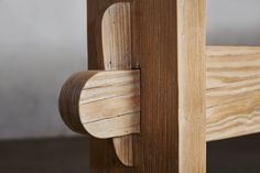 a close up of a wooden bed frame