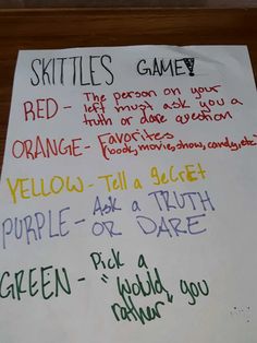 a piece of paper with writing on it that says skittles game and orange