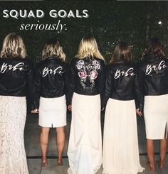 the bridesmaids are dressed in black jackets and white dresses with embroidered flowers on them