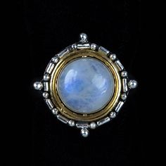 This Rainbow Moonstone mixed metal ring is handcrafted in Sterling Silver and 18K Gold Vermeil in a captivating Balinese style. The boho-chic ring features an opulent Moonstone embellished with intricate Balinese detail and elegant spiral designs. Accenting the enchanting Rainbow Moonstone is a rim of 18K Gold, which enhances the ring's unique aesthetic. Since ancient times, Rainbow Moonstones have been used in sacred rituals for their mystical properties. These semi-precious gemstones are belie Mixed Metal Ring, Balinese Style, Rainbow Moonstone Jewelry, Mixed Metal Rings, Ring Bracelet Chain, Rainbow Moonstone Ring, Moonstone Jewelry, Metal Ring, Unique Aesthetic