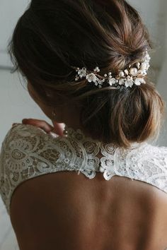 the back of a woman's head wearing a bridal hair comb