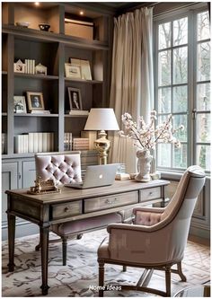 a desk with a laptop and chair in front of a window