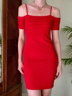 "Vintage Y2K Hugo Buscati Off the Shoulder Dress//This was a brand sold at Victorias Secret. Sultry crimson red stretch fabric with pin tuck detailing at the bust and sleeves. The most gorgeous and flirty piece, highly glamorous! Would be the perfect holiday dress. In amazing condition! Size XS, but please compare your measurements and ask me questions. Made in the USA. Price firm Bust: 31\" Waist: 27.5\" Hip: 35-37\" Length: 33.5\" We ship internationally!" Red Fitted Elastane Dress, Fitted Red Elastane Dress, Fitted Off-shoulder Pleated Midi Dress, Red Pleated Mini Dress For Evening, Formal Red Ruched Bodycon Dress, Fitted Red Pleated Midi Dress, Red Off The Shoulder Dress, Crimson Red, Off The Shoulder Dress