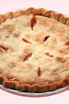 a pie sitting on top of a white plate