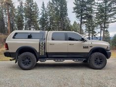 a large truck parked on top of a gravel road