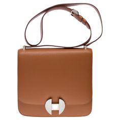 Rare​ ​Hermès​ ​2002​ ​shoulder​ ​bag​ ​in​ ​Gold​ ​Evercolor​ ​leather,​ ​palladium​ ​silver​ ​metal​ ​hardware,​ ​adjustable​ ​shoulder​ ​strap​ ​in​ ​gold​ ​leather​ ​for​ ​a​ ​shoulder​ ​or​ ​crossbody​ ​carry Flap​ ​closure A​ ​patch​ ​pocket​ ​on​ ​the​ ​front​ ​and​ ​back​ ​of​ ​the​ ​bag Gold​ ​leather​ ​inner​ ​lining,​ ​2​ ​compartments,​ ​two​ ​patch​ ​pockets Signature:​ ​"Hermès​ ​Paris​ ​Made​ ​in​ ​France"​ ​​ ​ Stamp:​ ​​Y​ ​(2020) Dimensions:​ ​20x19x5​ ​cm​ ​(7,8x7,5x2​ ​Inches France Stamp, Gold Leather, Metal Hardware, Birkin Bag, Gucci Jackie Bag, Dior Saddle Bag, Fashion Handbags, Hermes Bag Birkin, Vintage Gucci