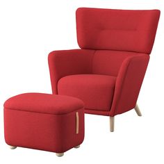 a red chair and footstool sitting next to each other