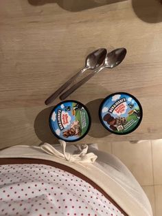 two spoons and some food on a table