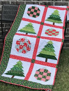 a quilted christmas tree sitting on top of a bench