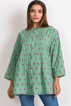 Our Amisha Cotton Tunic is a popular new addition to our sustainable apparel collection. Made with printed 100% cotton fabric, this fair trade tunic features a button down front and roll up button sleeves. These soft cotton tunic tops are free size, and are designed for an elegant, comfortable fit up to size XXL. One size fits most. Spring Green Cotton Tunic, Casual Cotton Kurta With Button Closure, Spring Cotton Button-up Tunic, Bohemian Green Blouse With Buttons, Casual Green Kurta For Spring, Green Bohemian Blouse With Buttons, Green Cotton Tops For Daywear, Green Cotton Summer Tunic, Traditional Button-up Cotton Blouse