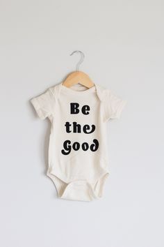 Be The Good Bodysuit. - screen printed using eco-friendly, water based inks - white colored onesie with black ink- 100% cotton Available in sizes Newborn (0-3M), 6M (6-12M), 12M (12-18M), 18M (18-24M) We recommend washing in cold water, on the delicate cycle. Tumble dry low heat. Sizing recommendation: true to size. Available in t-shirts for kids and adults. Please see corresponding listings for details. Boho Baby Clothes, Be The Good, Newborn Coming Home Outfit, Organic Cotton Baby, Coming Home Outfit, Trendy Baby, Boho Baby, Organic Cotton Fabric, Home Outfit