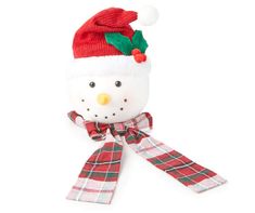 a stuffed snowman wearing a red hat and scarf