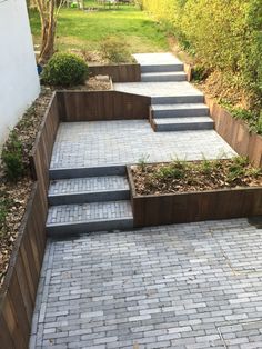 a brick walkway with steps leading up to it