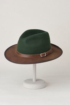 Bask in your own outback adventure with the Pinnacle, exquisitely created in bold two-tone and tone-on-tone styles. Whether you're exploring a dusty trail or strolling along a shimmering stream, this handmade, 100% wool hat will shade you with its wide, cowhide leather brim. Accented with a leather band and buckle, the Pinnacle is appointed with an interior drawstring sweatband to keep you cool and ensure a comfortable fit. Fall Six-panel Hat For Outdoor, Fall Six-panel Outdoor Hat, Fall Outdoor Six-panel Hat, Leather Fedora For Outdoor Winter Activities, Leather Fedora For Outdoor Winter Use, Leather Fedora For Winter Outdoor Events, Country Style Leather Felt Hat For Outdoor, Leather Brimmed Felt Hat For Outdoor, Leather Country Style Felt Hat For Outdoor