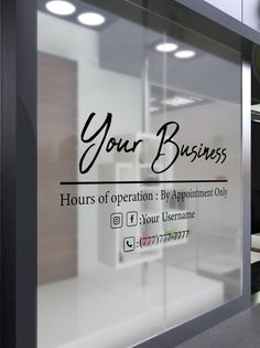 an office window with the words your business written on it's glass front door