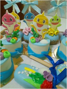 there are many cupcakes that have been made to look like baby shark cakes